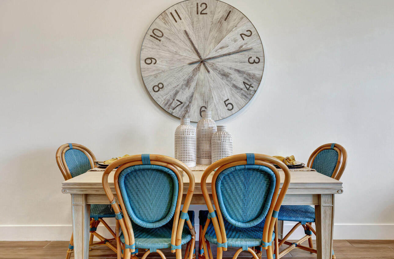 608 Waters Edge Lane, Unit 2202 Port St. Lucie, FL 34983 - Photo 6 of 19 a view of dining area with chandelier fan and wooden floor