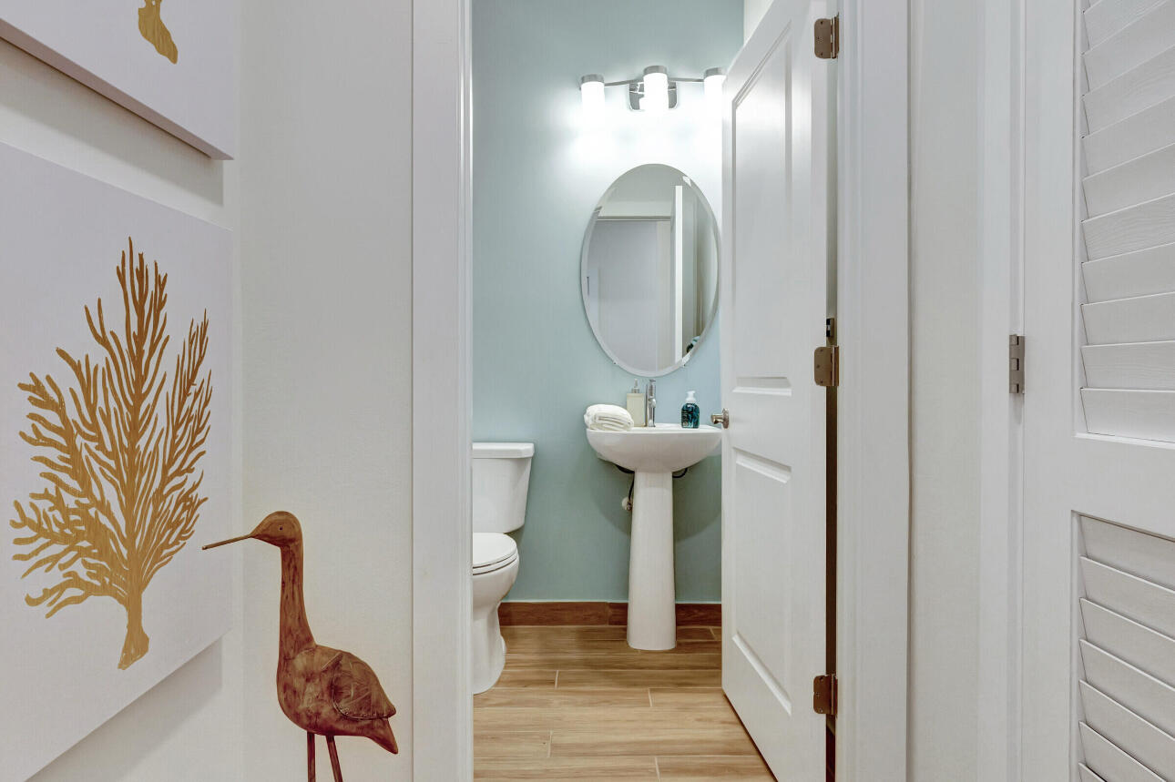 608 Waters Edge Lane, Unit 2202 Port St. Lucie, FL 34983 - Photo 10 of 19 a bathroom with a sink and a mirror