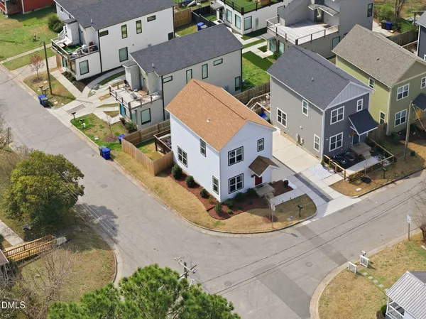 an aerial view of a house with yard swimming pool and outdoor seating