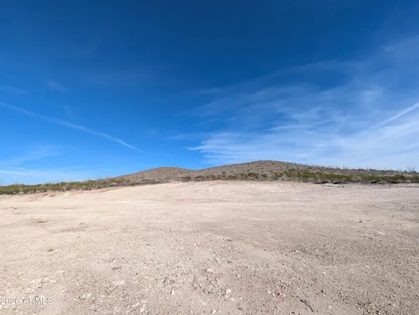 a view of an ocean beach and mountain