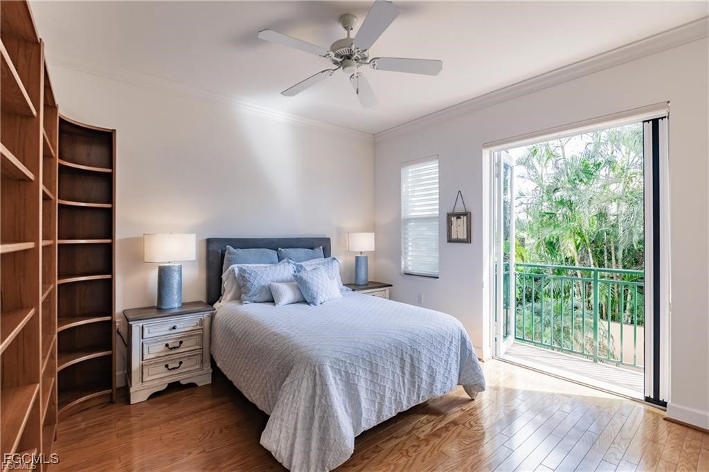 572 11th Avenue South, Unit 2 Naples, FL 34102 - Photo 11 of 28 a bedroom with a bed and a window