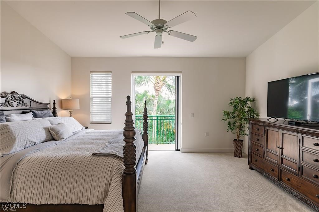 572 11th Avenue South, Unit 2 Naples, FL 34102 - Photo 22 of 28 a bedroom with a bed and a flat screen tv