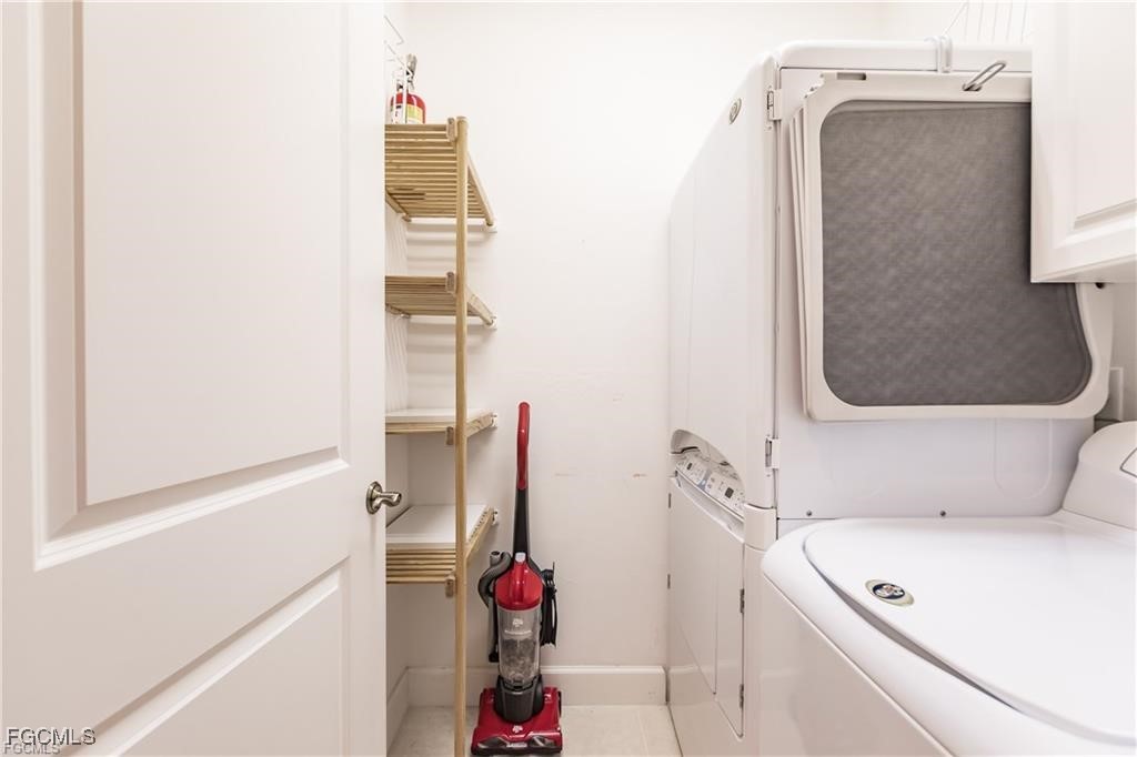 572 11th Avenue South, Unit 2 Naples, FL 34102 - Photo 24 of 28 a bathroom with a tub and shower