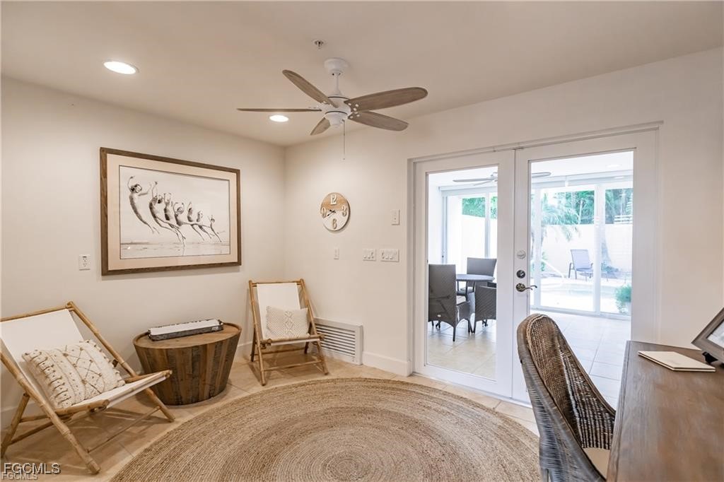 572 11th Avenue South, Unit 2 Naples, FL 34102 - Photo 25 of 28 a bedroom with furniture and a window
