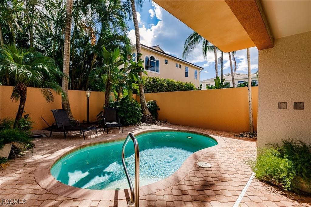 572 11th Avenue South, Unit 2 Naples, FL 34102 - Photo 26 of 28 a view of outdoor space and yard