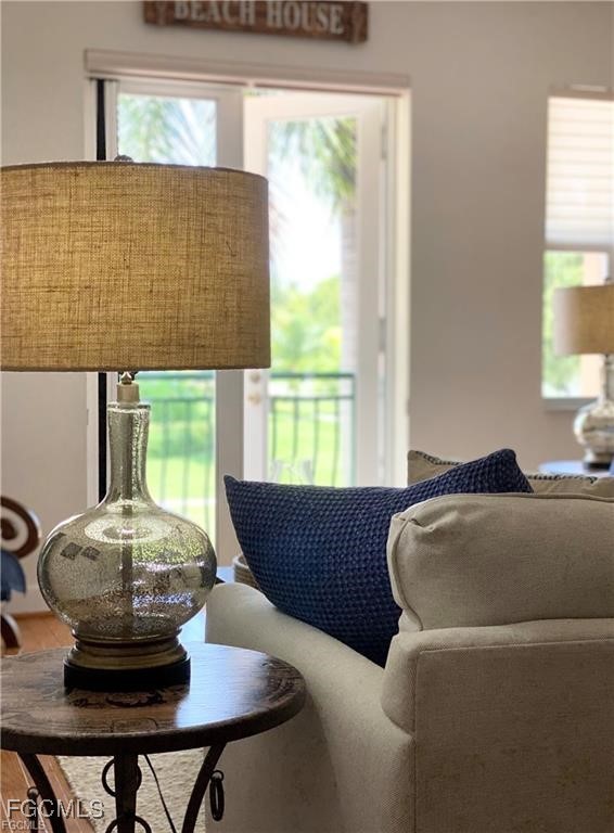 572 11th Avenue South, Unit 2 Naples, FL 34102 - Photo 4 of 28 a living room with furniture and a window