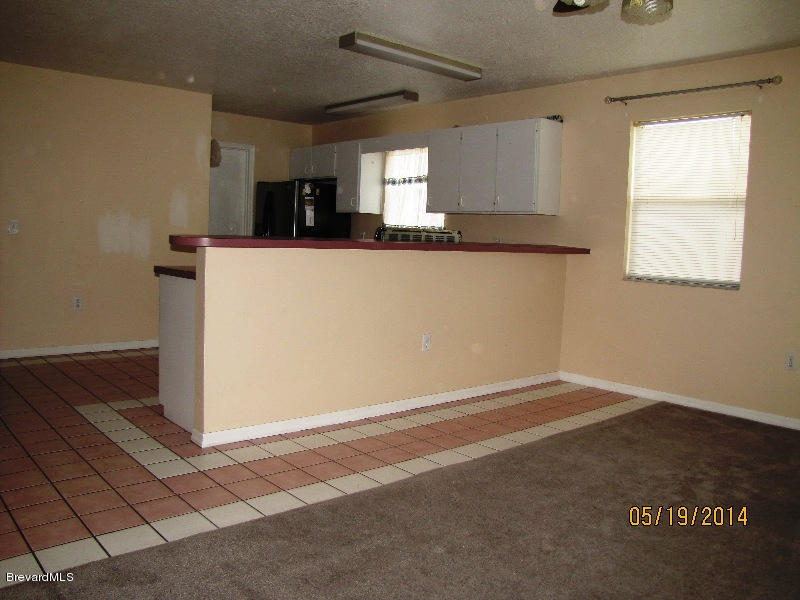 6055 Elgin Road Cocoa, FL 32927 - Photo 26 of 42 KITCHEN FROM FAMILY ROOM