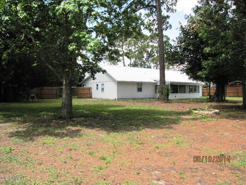 6055 Elgin Road Cocoa, FL 32927 - Photo 40 of 42 REAR YARD AND HOUSE