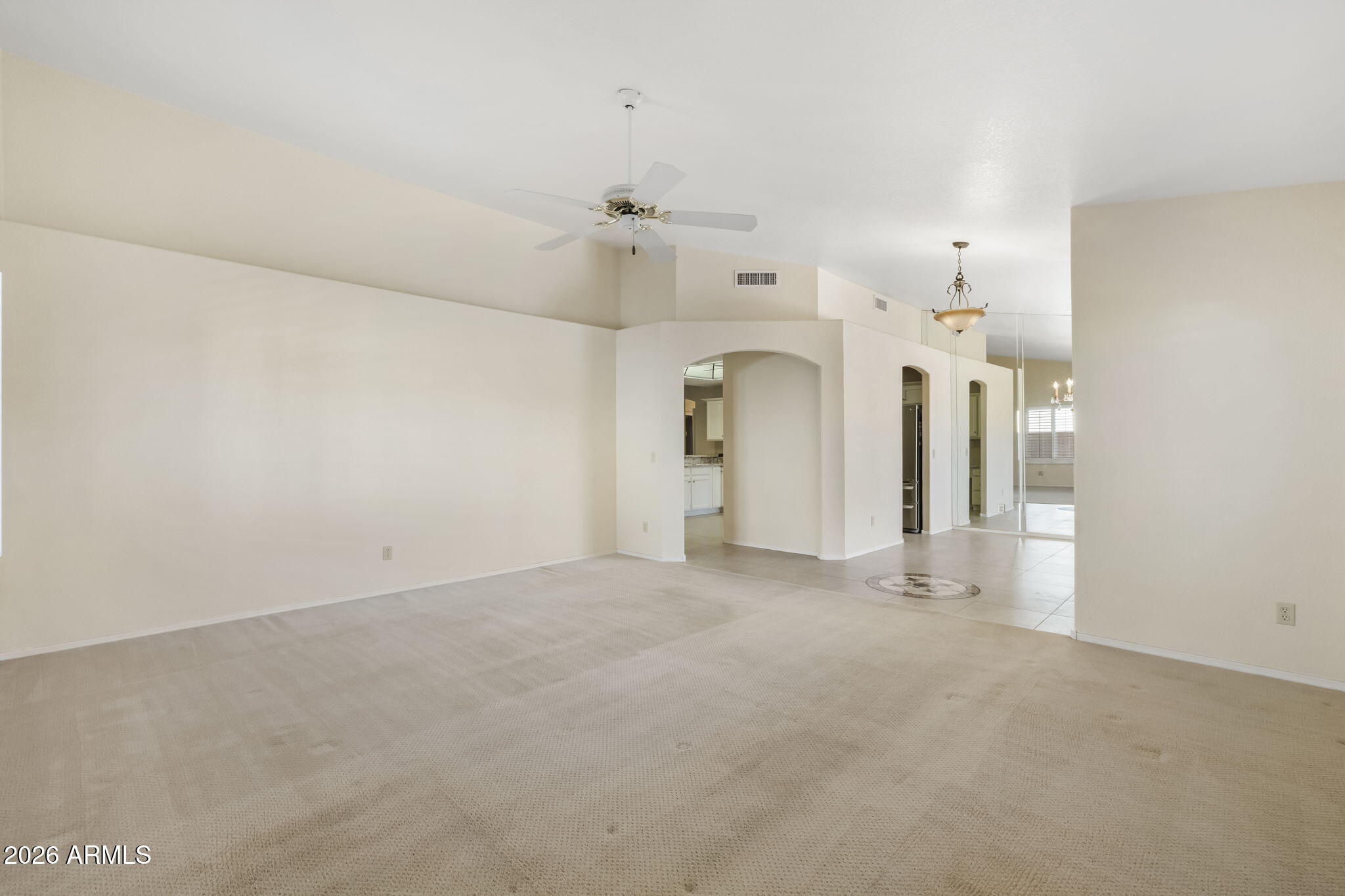20659 North 110th Avenue Peoria, AZ 85373 - Photo 23 of 85 an empty room with chandelier fan and windows