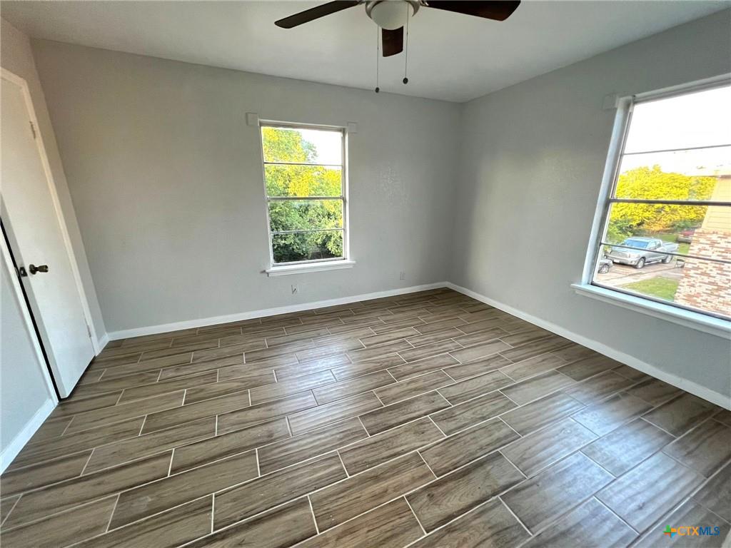805 Sissom Road Killeen, TX 76541 - Photo 18 of 35 Unfurnished room featuring wood finish floors and ceiling fan