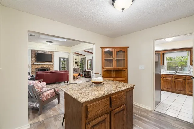 a view of kitchen island granite countertop living room