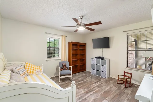 a bed room with a bed and a television