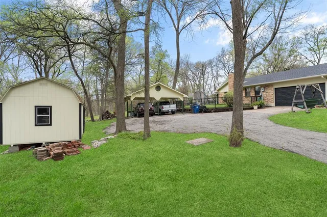 a view of a backyard with a garden