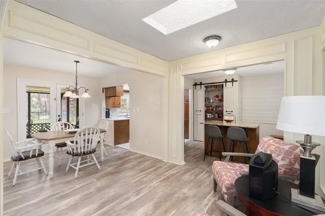 a dining room with furniture and window