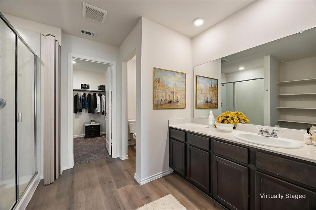 2811 Jasmine Drive Sherman, TX 75092 - Photo 14 of 22 a bathroom with a sink and mirror