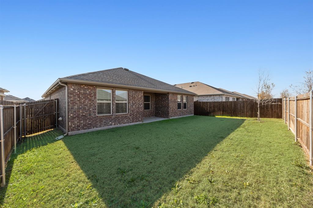 2811 Jasmine Drive Sherman, TX 75092 - Photo 22 of 22 a front view of a house with garden