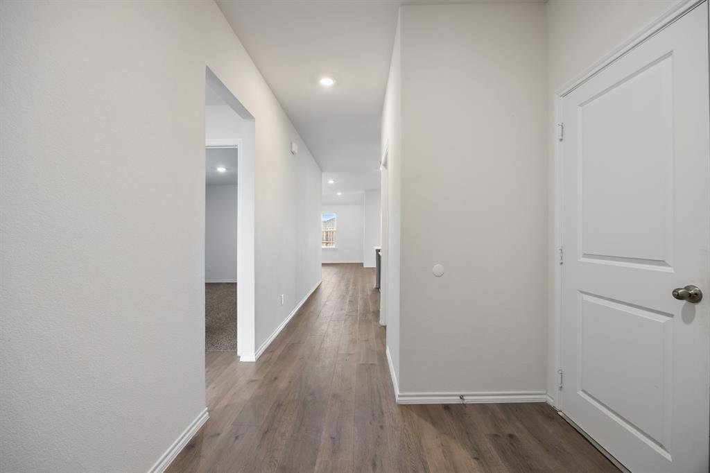 2811 Jasmine Drive Sherman, TX 75092 - Photo 3 of 22 a view of a hallway with wooden floor