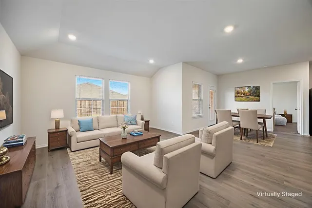 a living room with furniture and a table