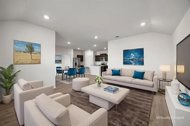 a living room with furniture and a table