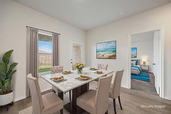 a view of a dining room with furniture window and wooden floor
