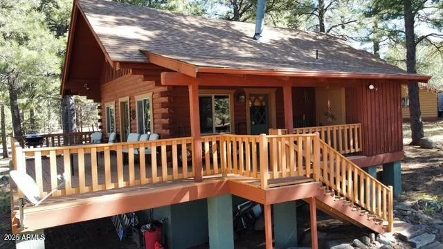 a view of a chair and tables in the balcony