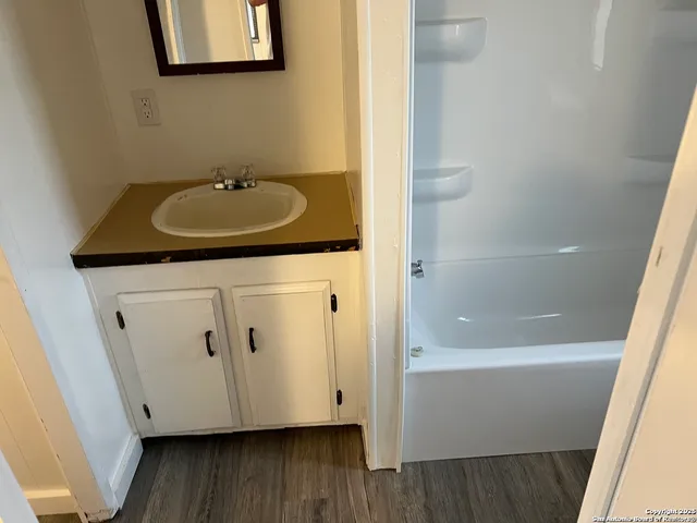 a bathroom with a sink and a mirror