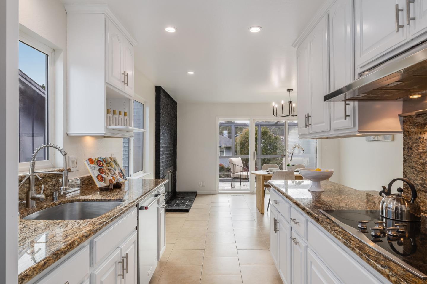 121 Riverside Drive San Bruno, CA 94066 - Photo 11 of 66 a kitchen with stainless steel appliances a sink stove and cabinets