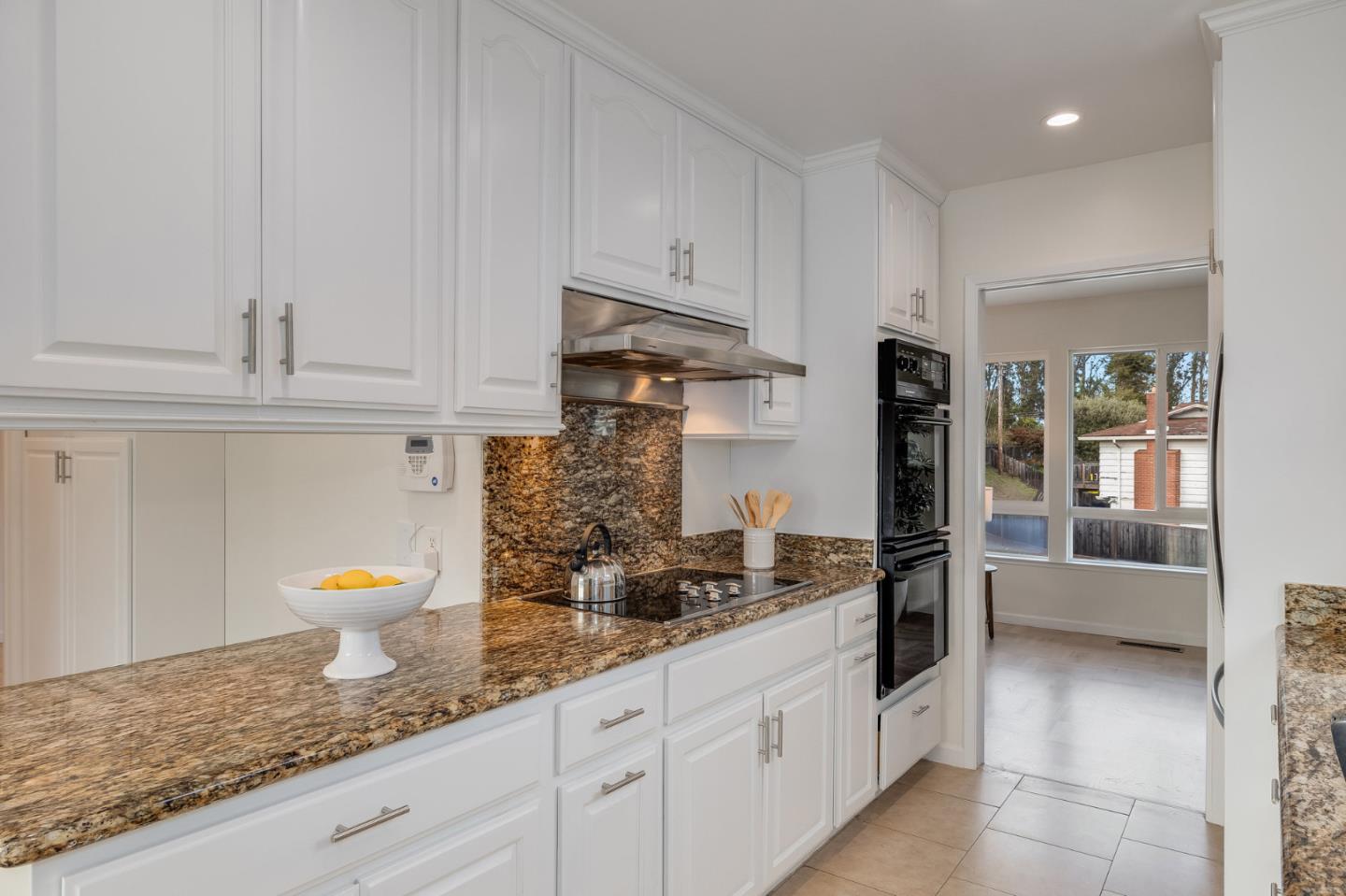 121 Riverside Drive San Bruno, CA 94066 - Photo 13 of 66 a kitchen with stainless steel appliances granite countertop a refrigerator and stove