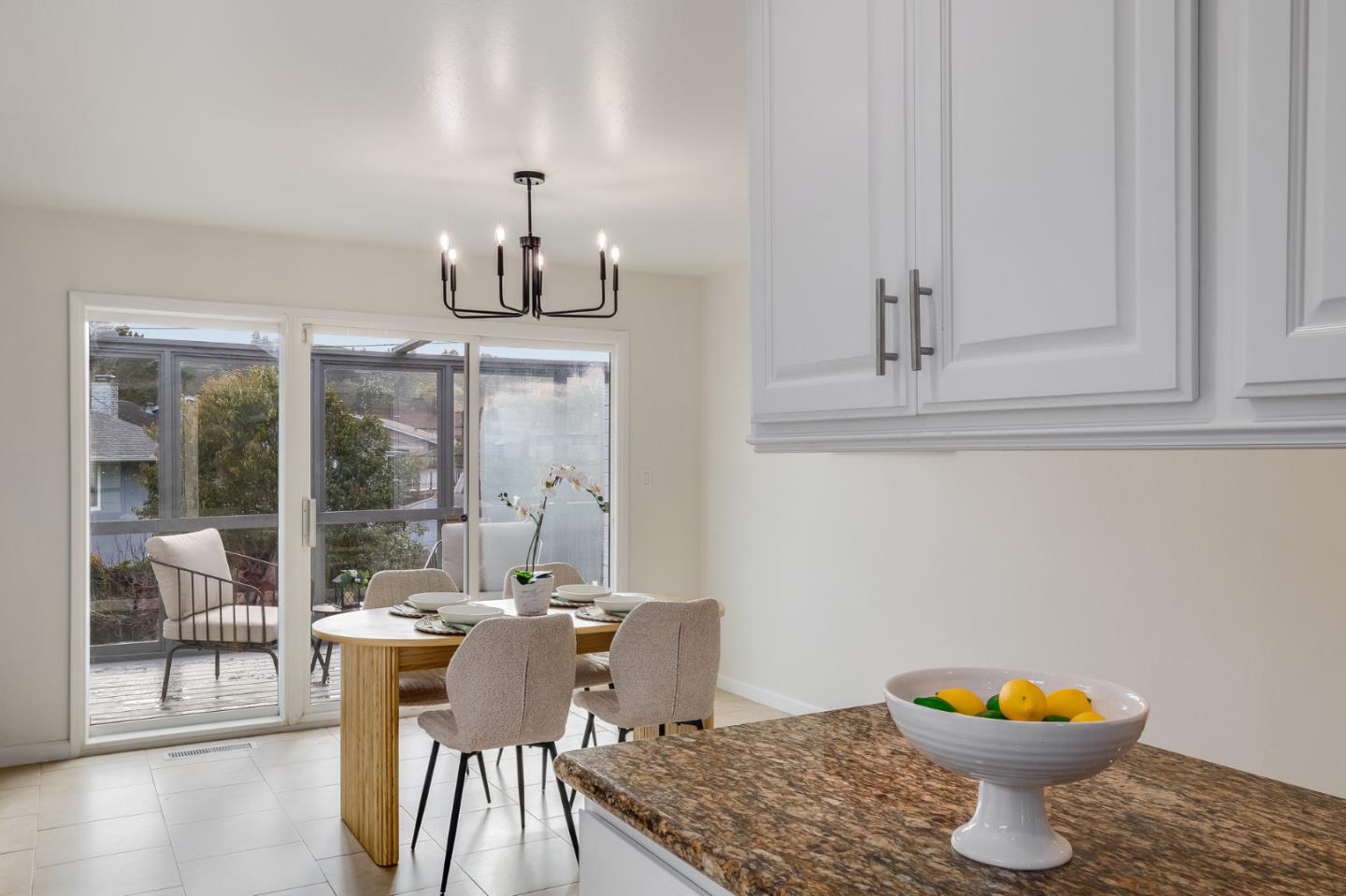 121 Riverside Drive San Bruno, CA 94066 - Photo 14 of 66 a view of a dining room with furniture wooden floor and a chandelier