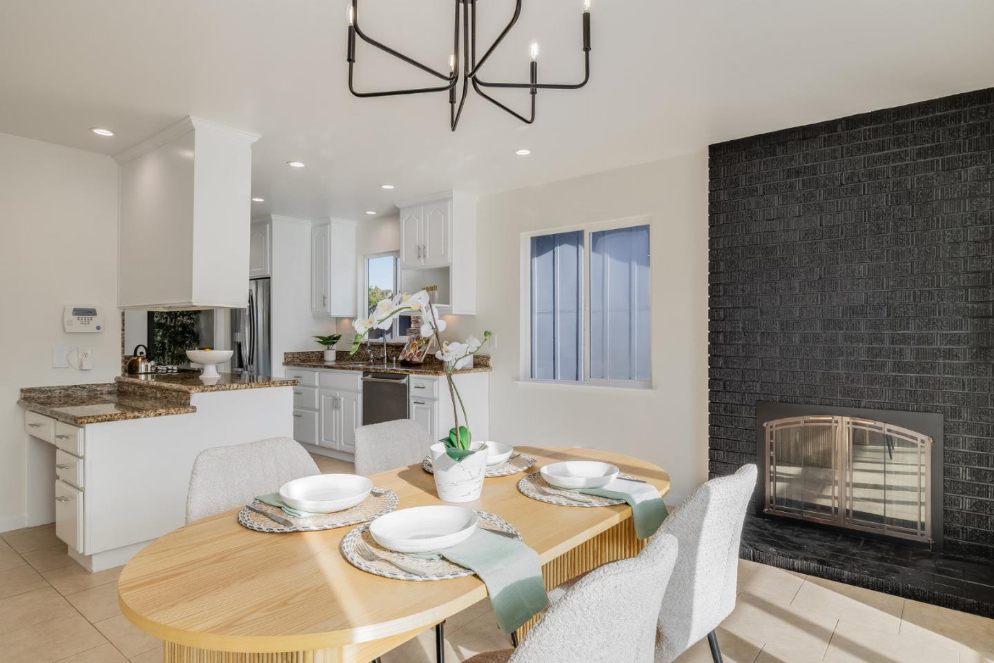 121 Riverside Drive San Bruno, CA 94066 - Photo 15 of 66 a dining room with furniture or wooden floor and a chandelier
