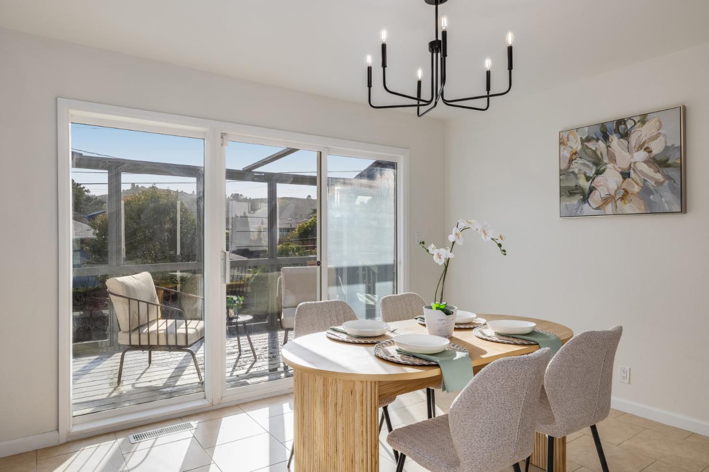 121 Riverside Drive San Bruno, CA 94066 - Photo 18 of 66 a view of a dining room with furniture large windows and wooden floor