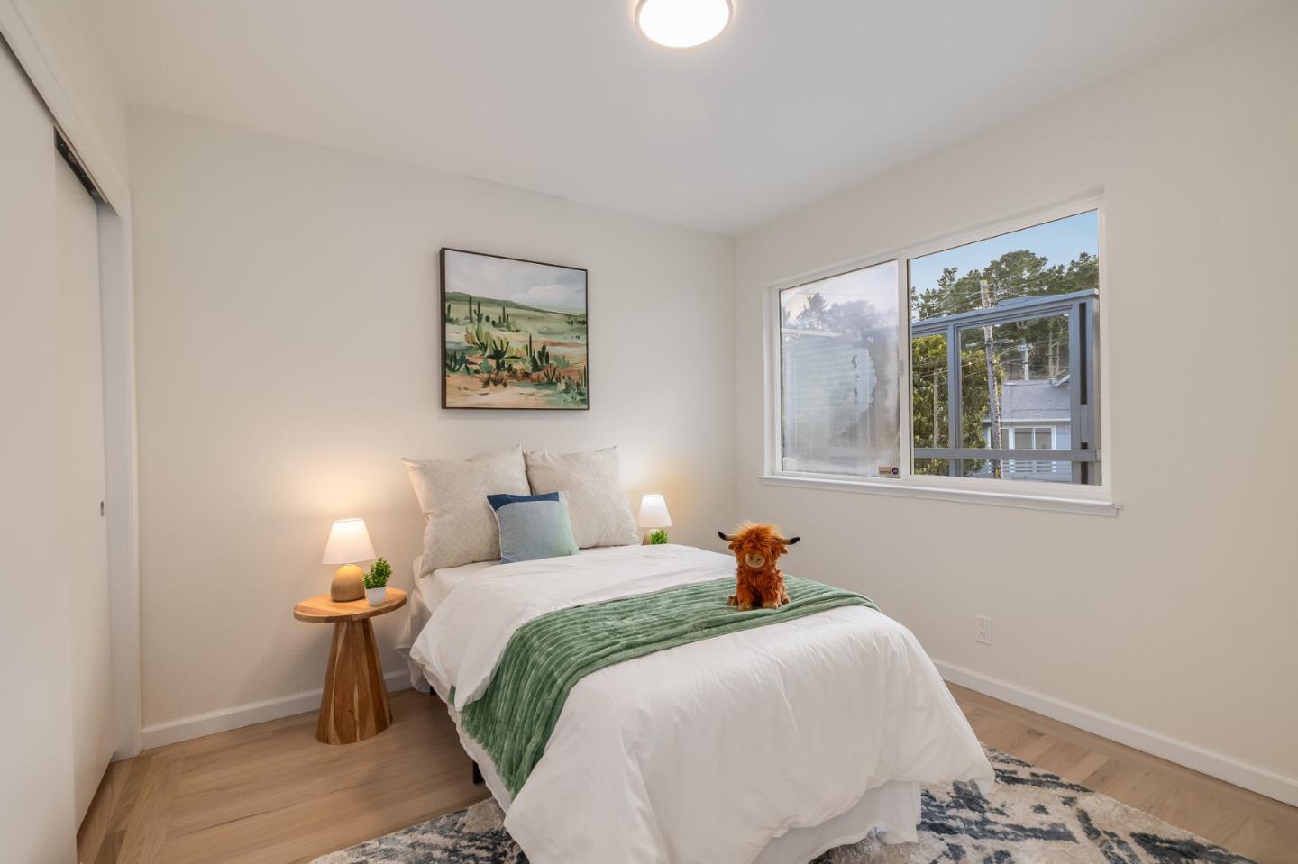 121 Riverside Drive San Bruno, CA 94066 - Photo 23 of 66 a bedroom with a bed and a window