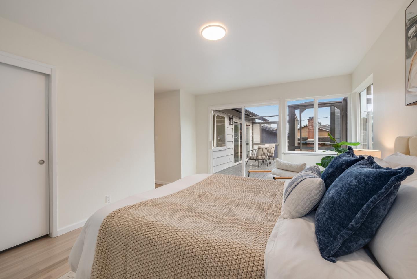 121 Riverside Drive San Bruno, CA 94066 - Photo 29 of 66 a living room with a bed furniture and a large window