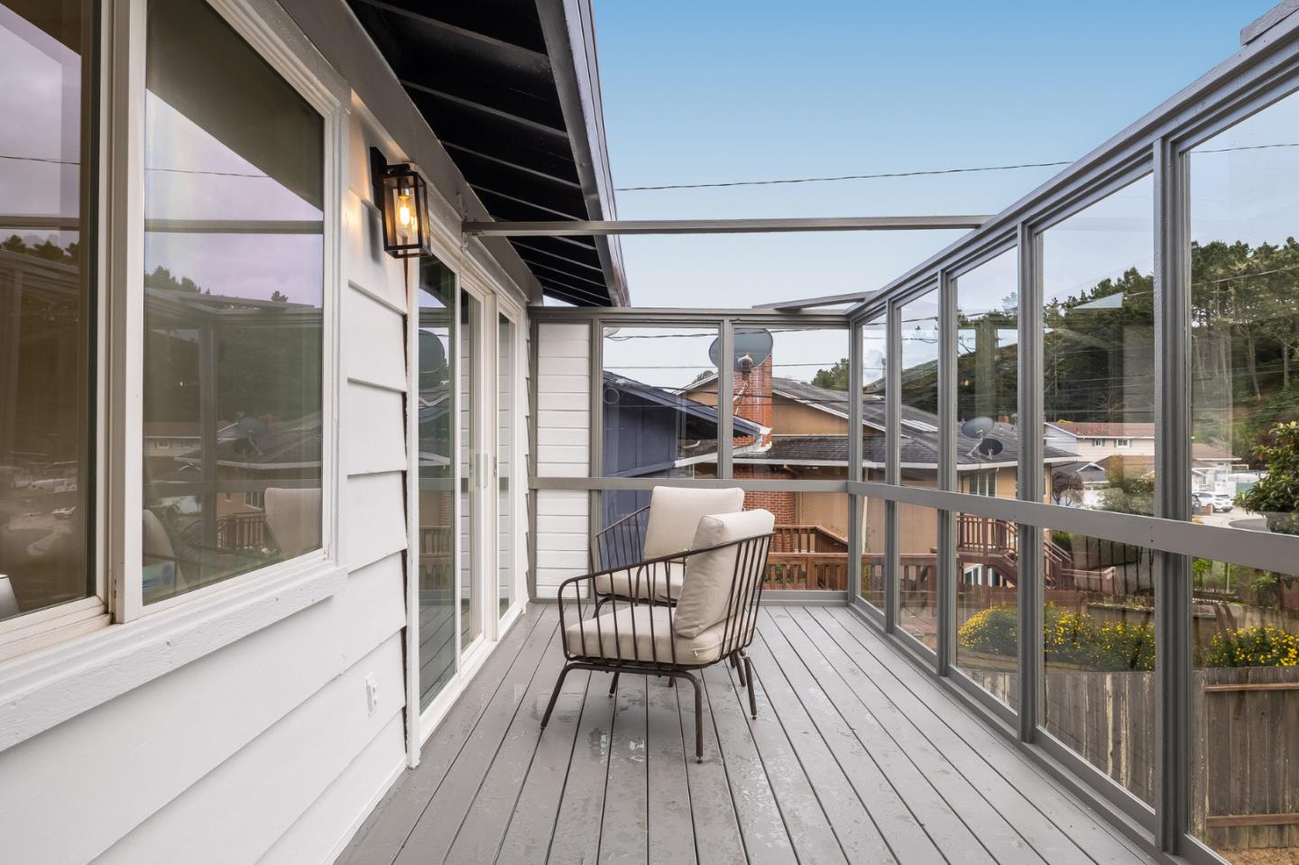 121 Riverside Drive San Bruno, CA 94066 - Photo 30 of 66 a view of a balcony with chairs and wooden floor