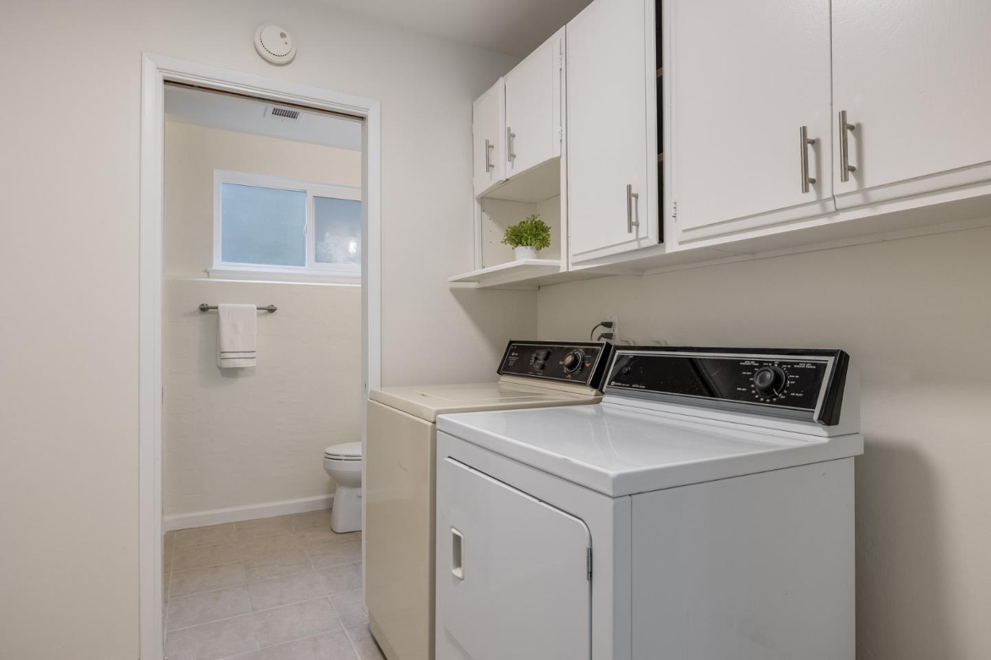 121 Riverside Drive San Bruno, CA 94066 - Photo 40 of 66 a utility room with dryer and washer