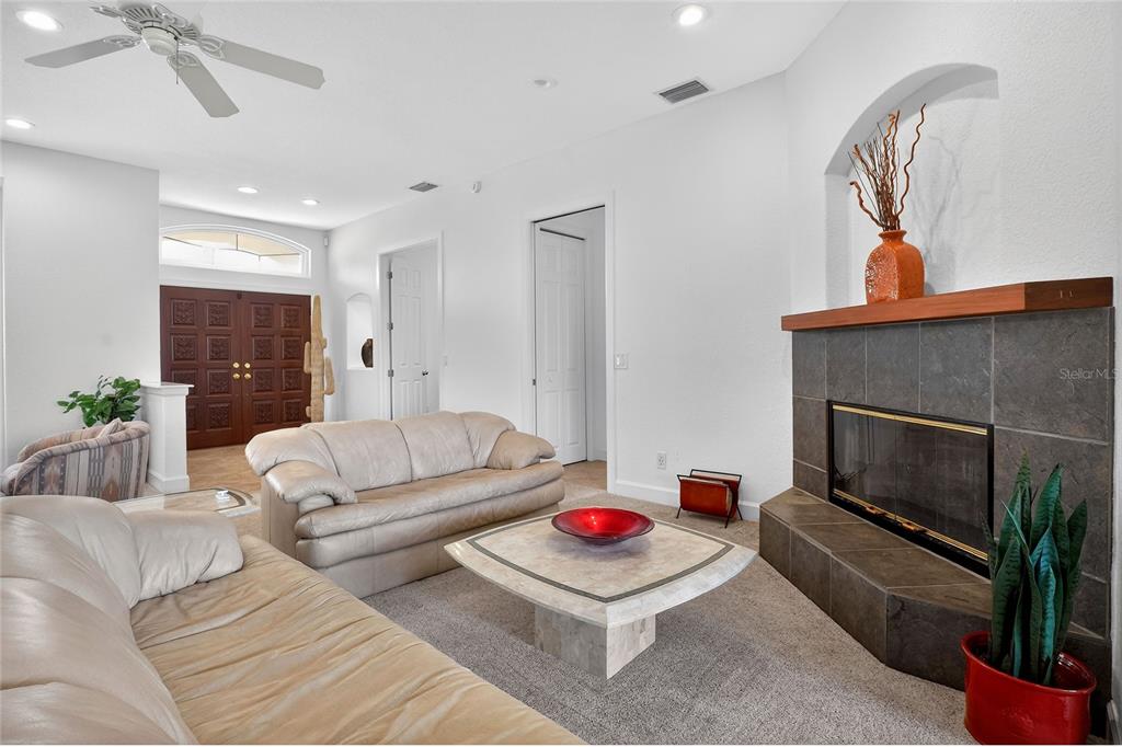 2968 Plantation Road Winter Haven, FL 33884 - Photo 13 of 81 a living room with furniture and a fireplace