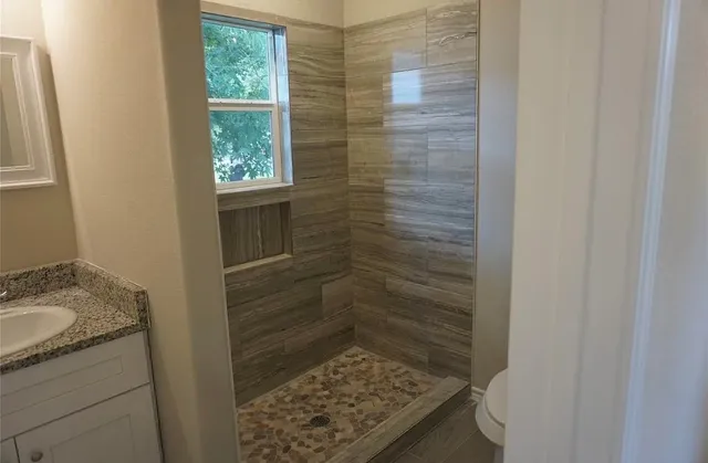 a bathroom with a sink and a shower