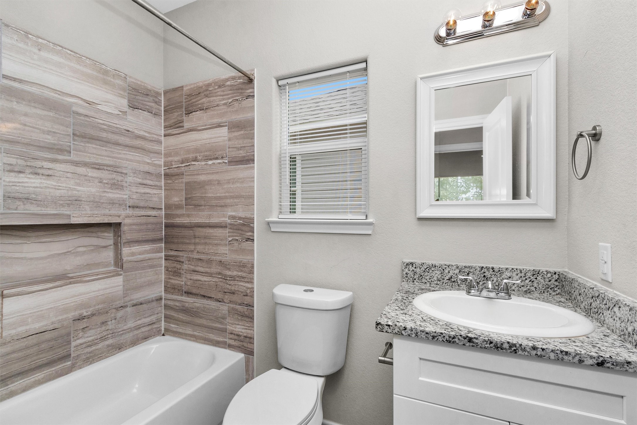 16706 East Hammon Montgomery, TX 77316 - Photo 18 of 26 a bathroom with a granite countertop sink toilet and bathtub