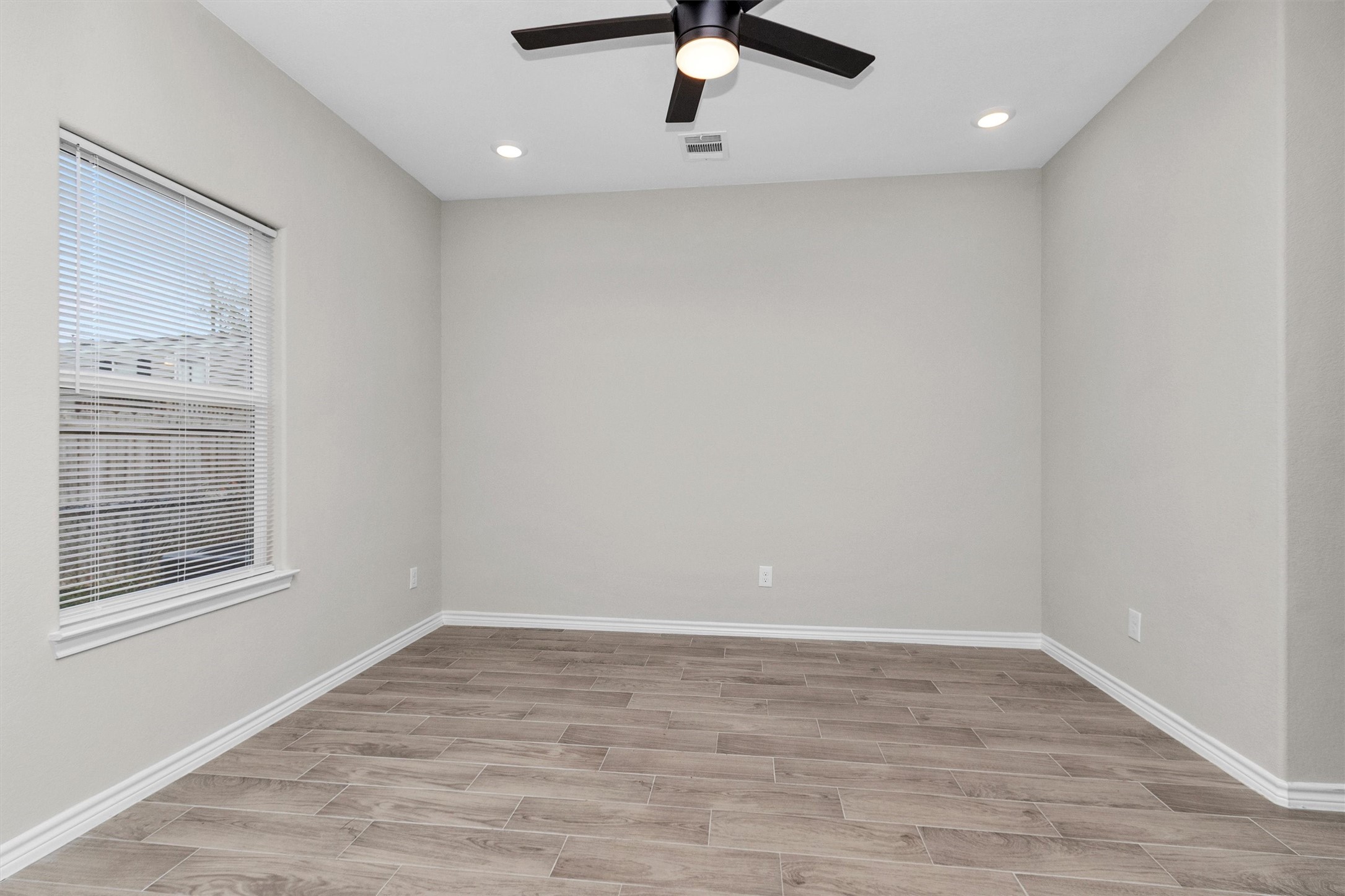 16706 East Hammon Montgomery, TX 77316 - Photo 22 of 26 wooden floor in an empty room with a window