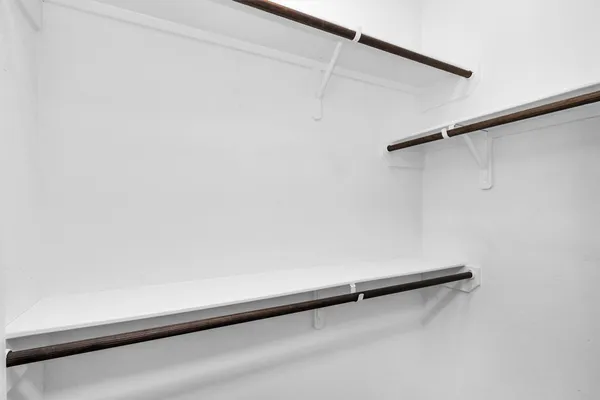 a view of a room with racks on the wall