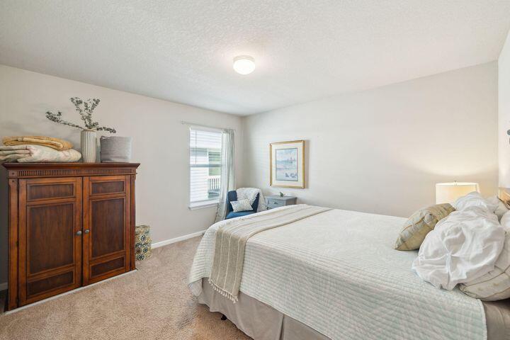 144 American Court Santa Rosa Beach, FL 32459 - Photo 14 of 19 a bedroom with a bed and a window