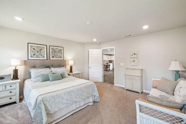 a bedroom with a bed and a couch