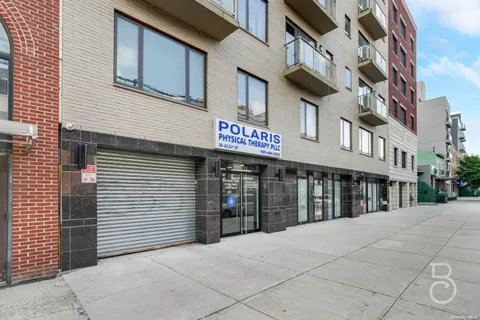 a view of a building with a street