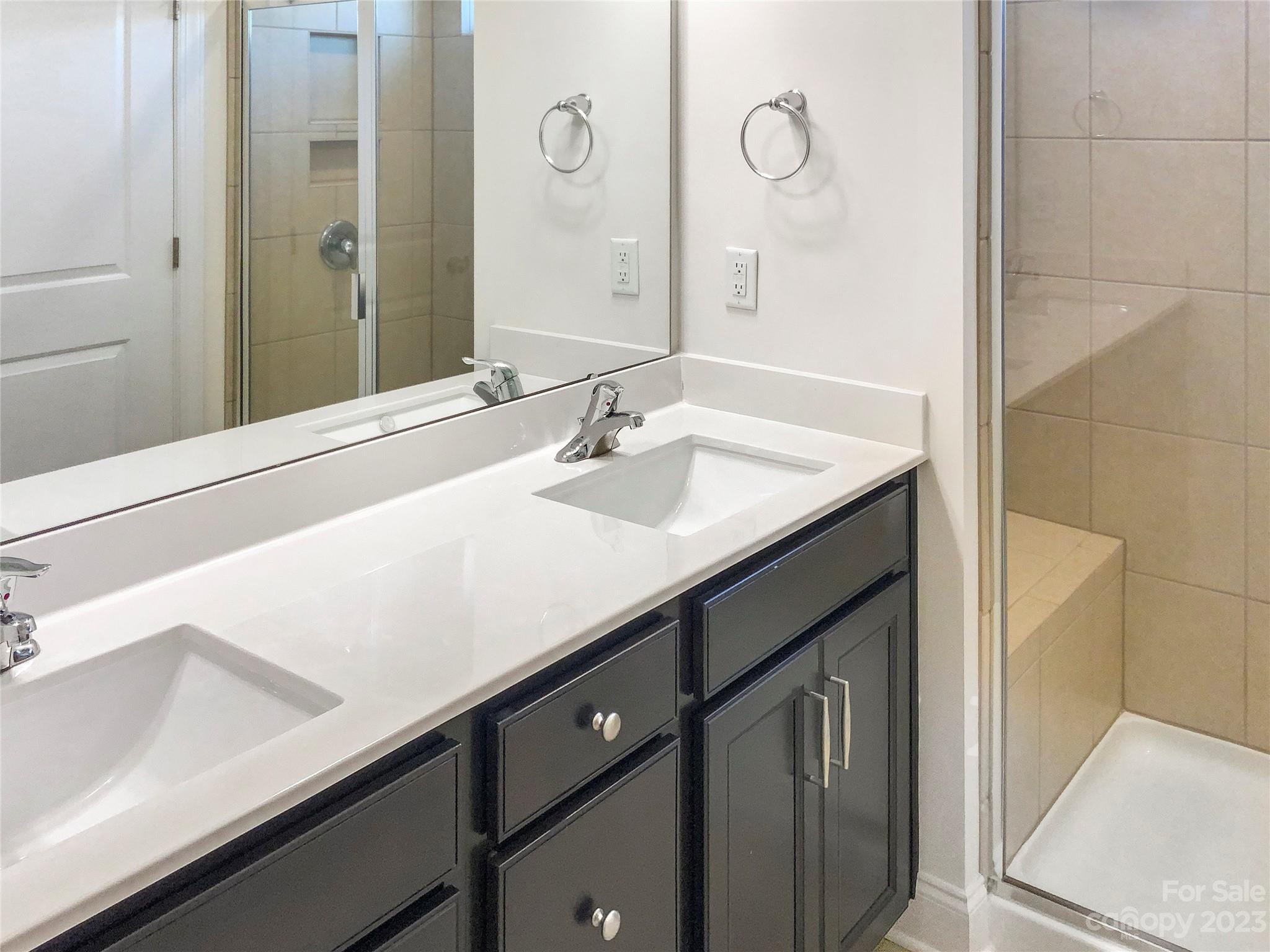 208 Waterlynn Ridge Road, Unit B Mooresville, NC 28117 - Photo 16 of 21 a bathroom with a sink and a mirror