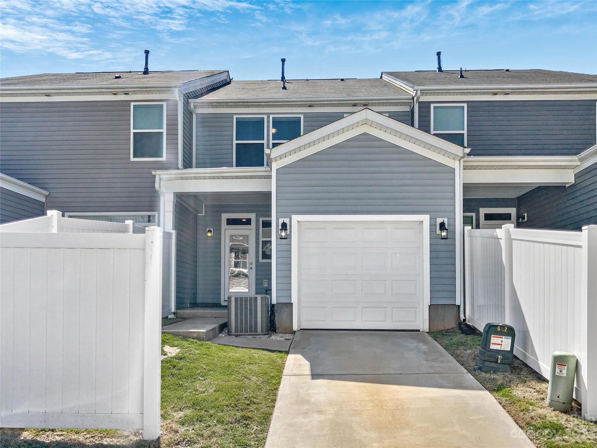 208 Waterlynn Ridge Road, Unit B Mooresville, NC 28117 - Photo 21 of 21 a view of a house with a garage
