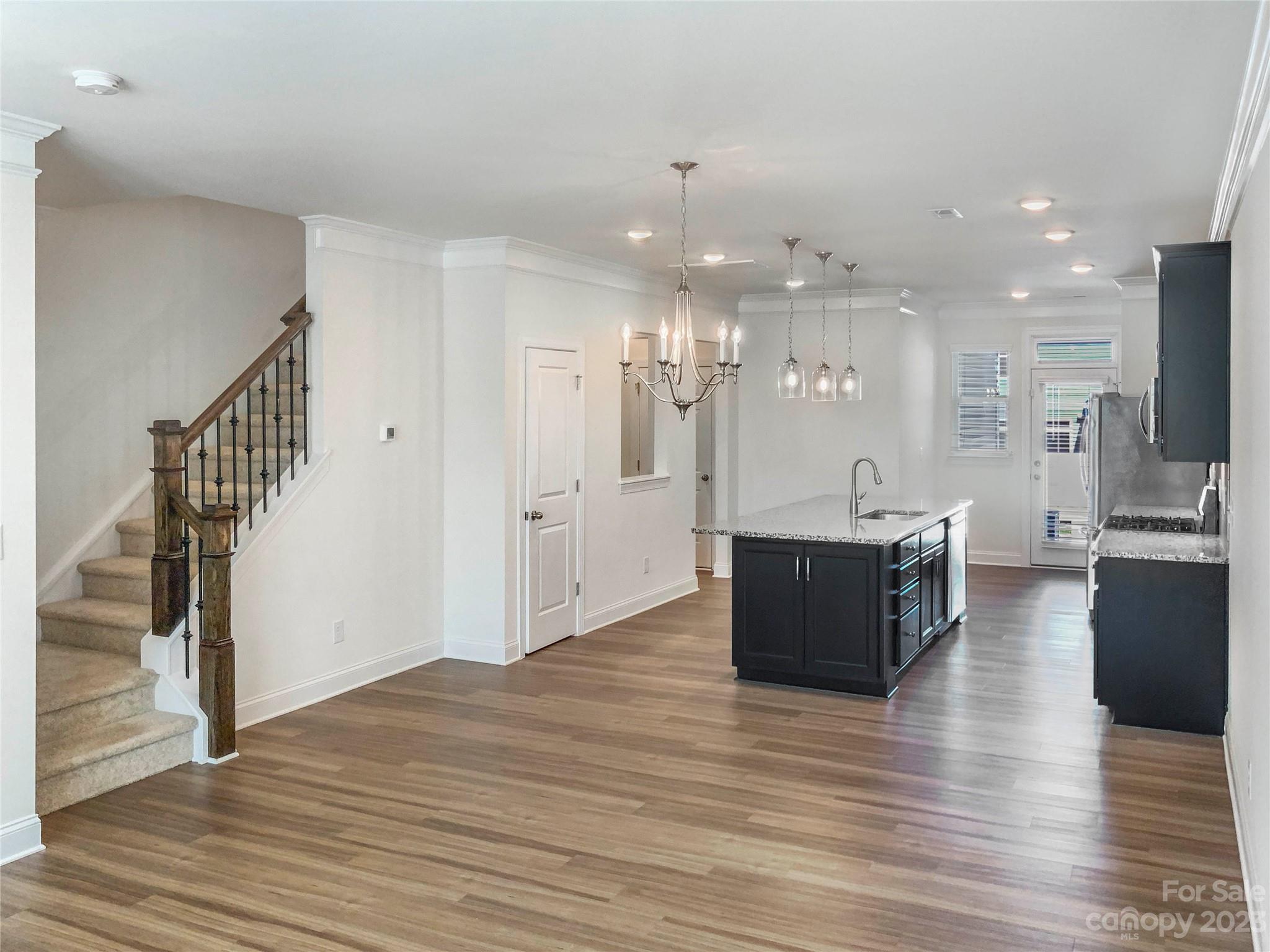 208 Waterlynn Ridge Road, Unit B Mooresville, NC 28117 - Photo 6 of 21 a large hall with lots of counter space and windows