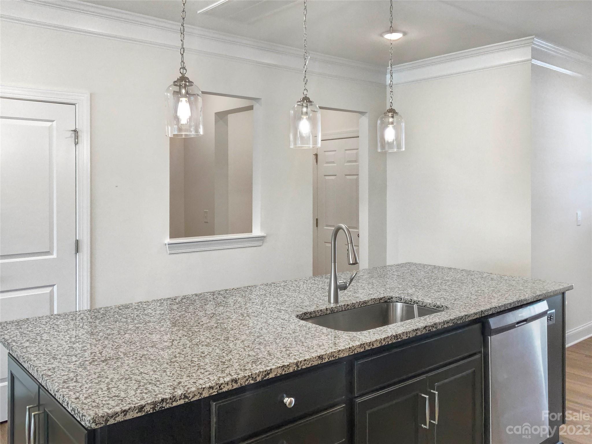 208 Waterlynn Ridge Road, Unit B Mooresville, NC 28117 - Photo 9 of 21 a kitchen with stainless steel appliances granite countertop a sink refrigerator and cabinets