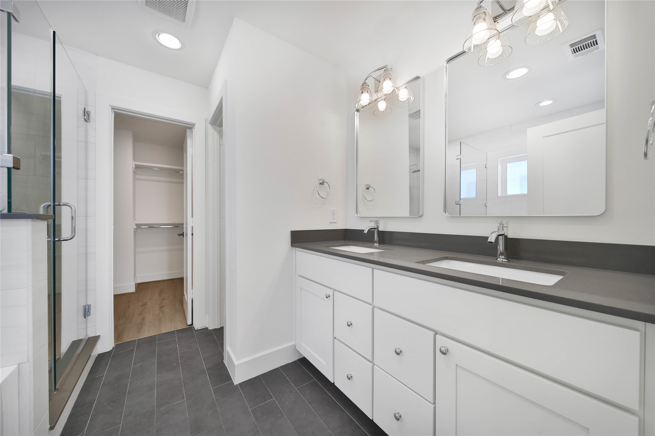 7407 Rusk Street, Unit A Houston, TX 77011 - Photo 9 of 24 Primary bathroom features double sinks.