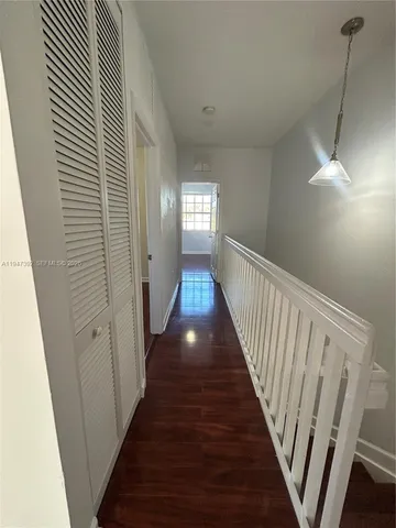 a view of gallery with wooden floor