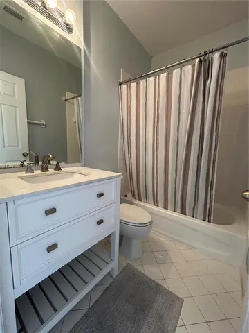 a bathroom with a toilet a sink and a mirror